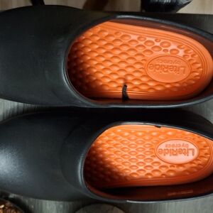 CROCS Black Clogs with Orange Accents